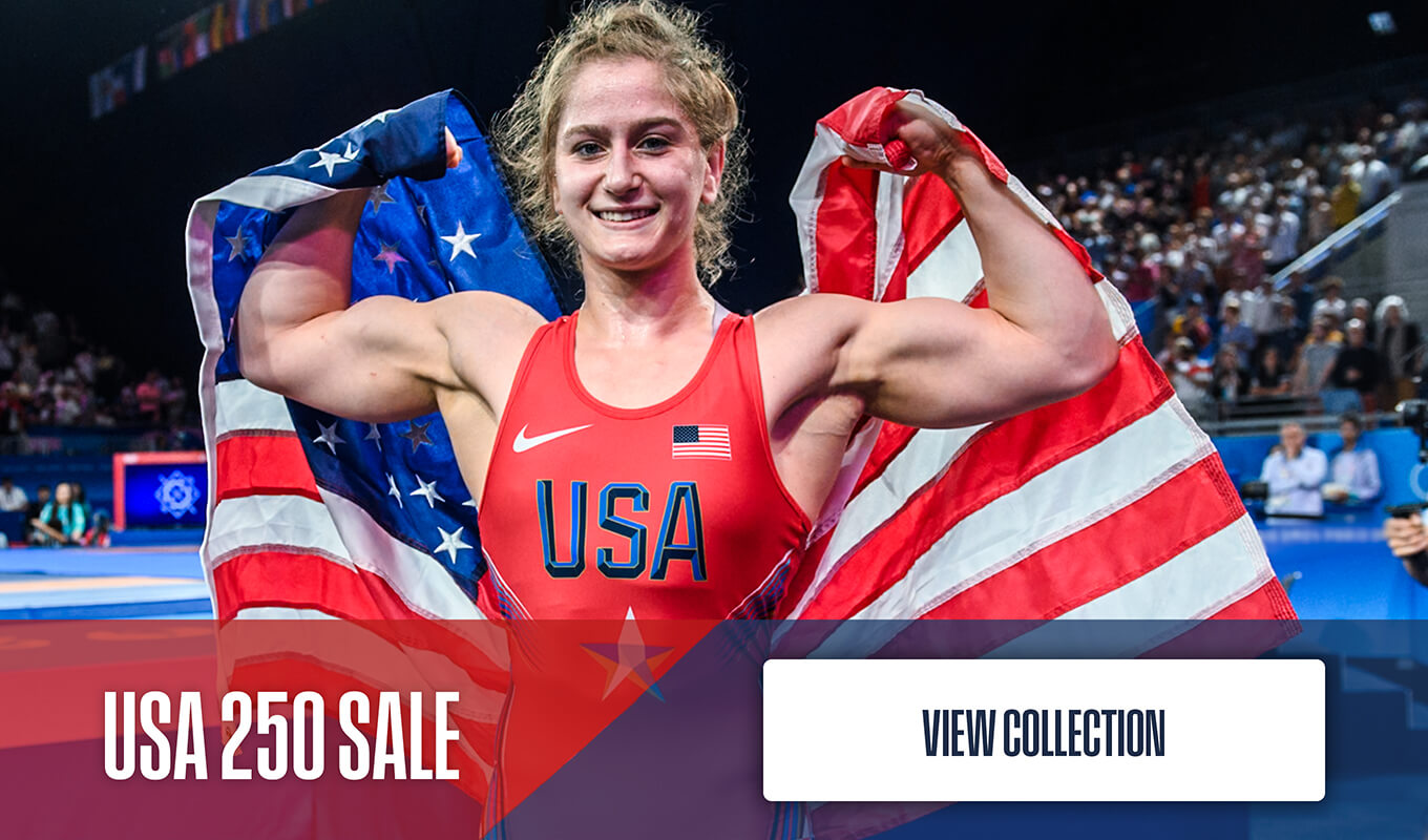 Amit Elor holding the American Flag, flexing her muscles with a big smile. Overlaid text promotes the Dollamur USA 250 Sale, including 15% off select home mats through July 7, 2026