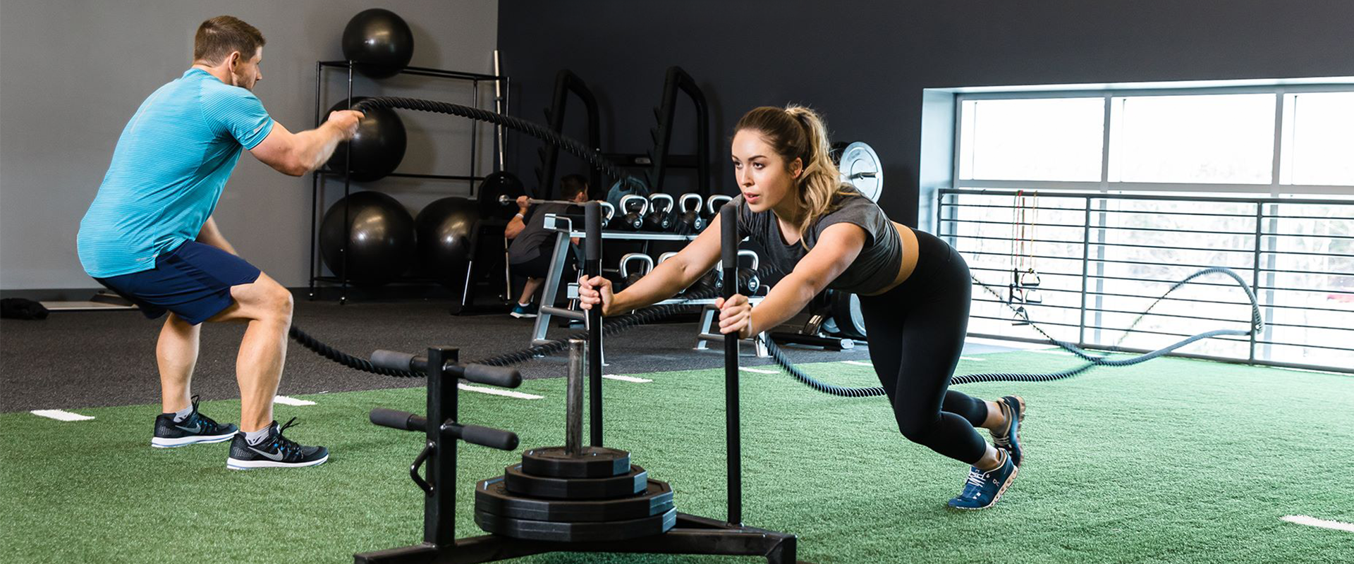 Athletes working out on gym flooring and indoor turf by Dollamur