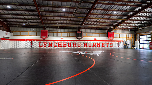 Wide-angle photo of the custom wrestling room Dollamur designed for the University of Lynchburg collegiate wrestling team