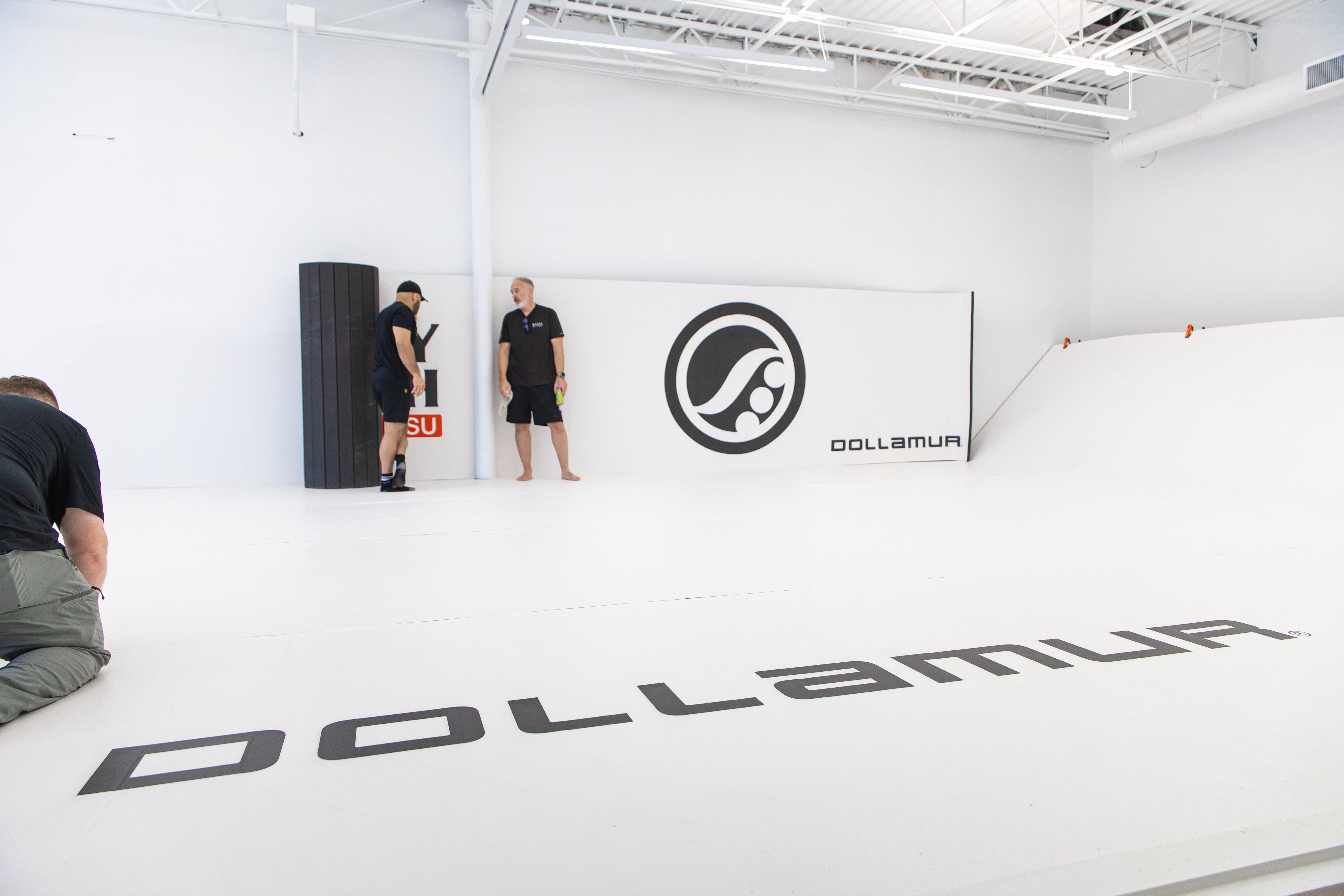 Gym wall padding in a commercial fitness facility showcasing safety and branded design