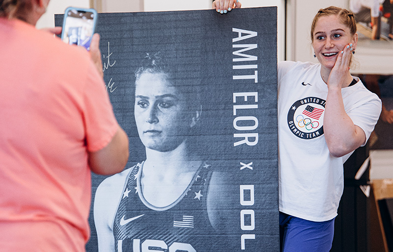 Amit poses with her custom 3x6 Dollamur fitness mat