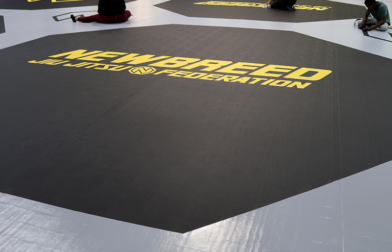 Custom BJJ Mats Made by Dollamur for NEWBREED Jiu Jitsu Federation