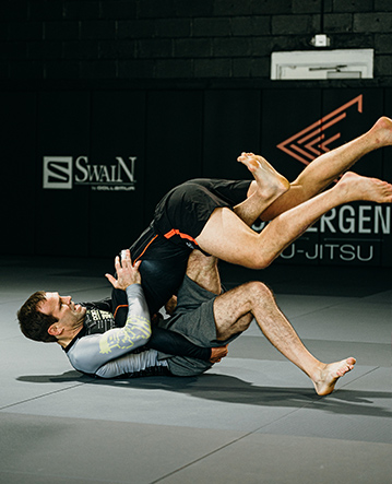 Two jiu-jitsu players sparring on Swain Mats by Dollamur